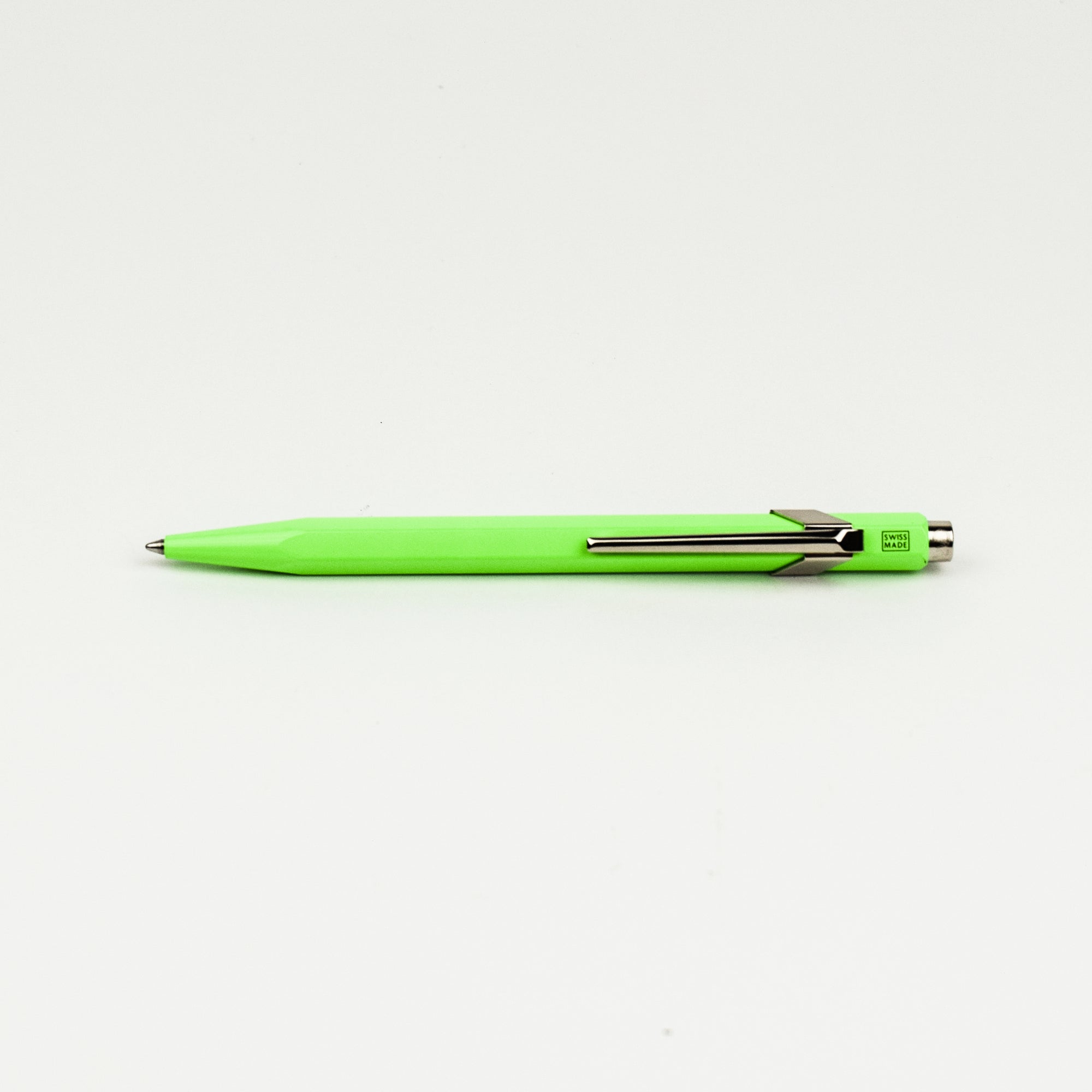 Neon green pen on a white background