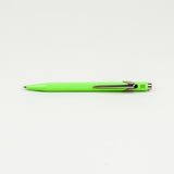 Neon green pen on a white background