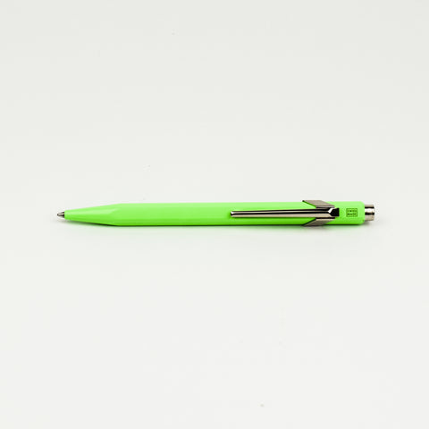 Neon green pen on a white background