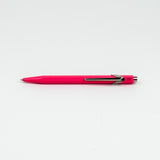 Pink pen with silver clip on a white background