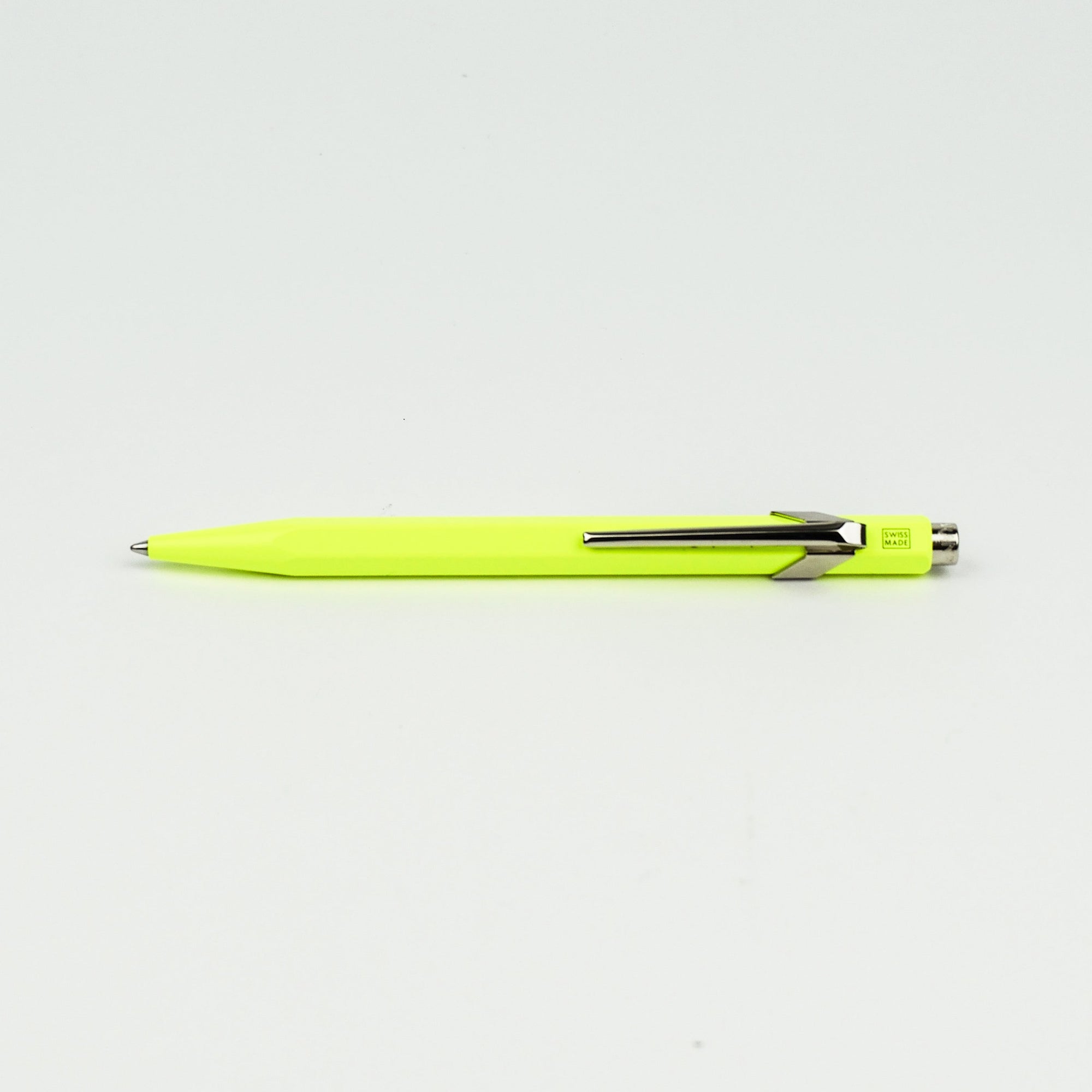 Neon yellow pen on a white background