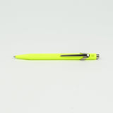 Neon yellow pen on a white background