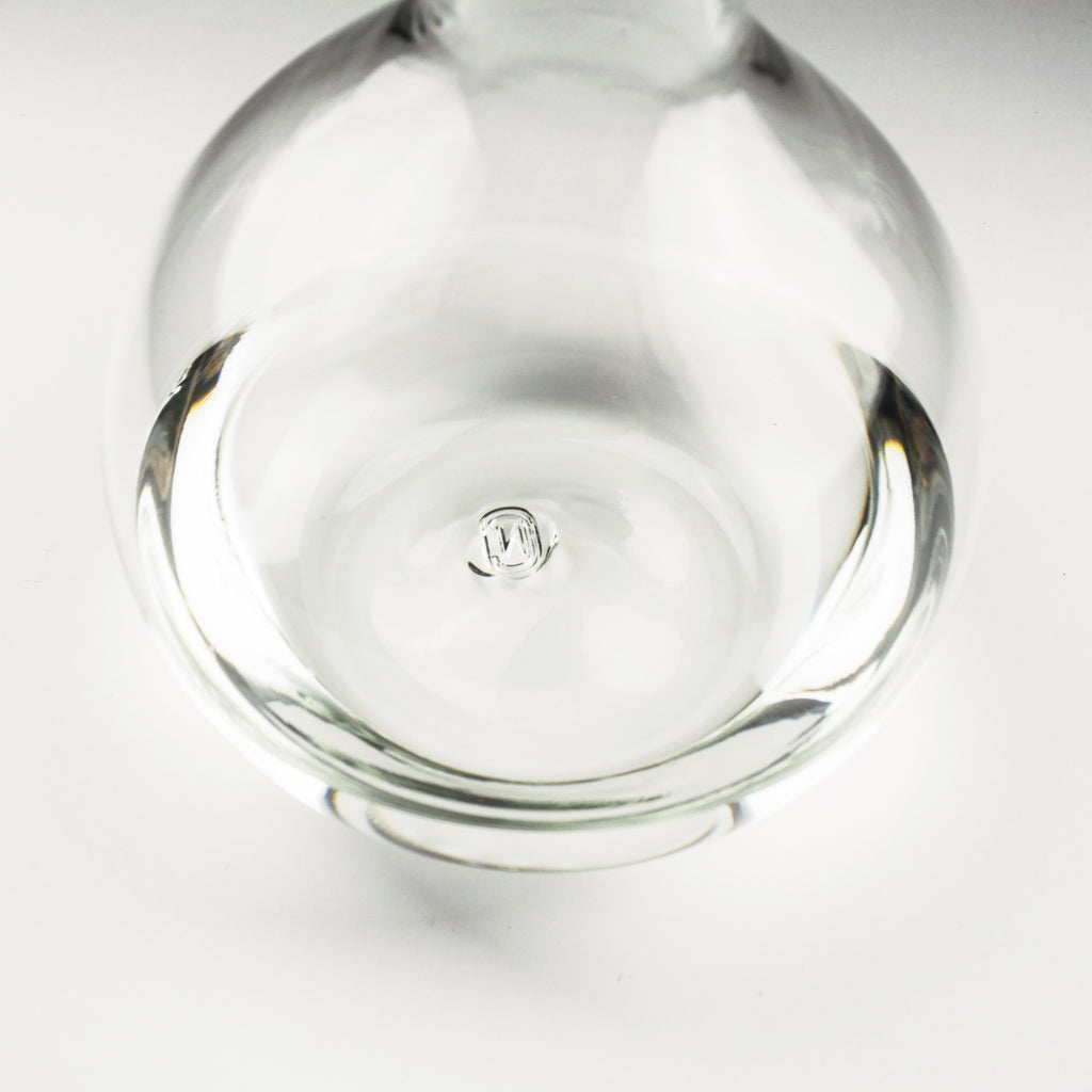 Clear glass object with a logo on a white background
