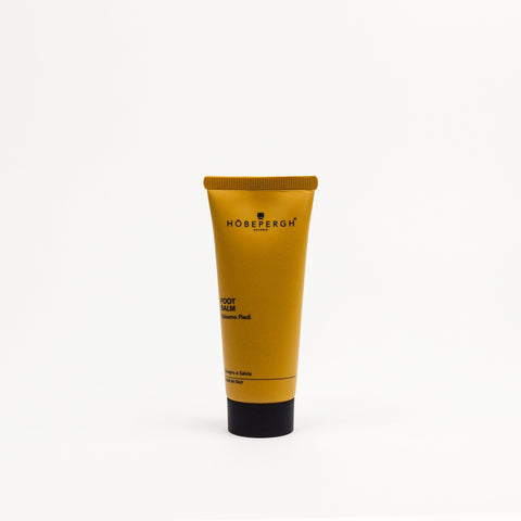 Yellow tube of Höbergh product on a white background