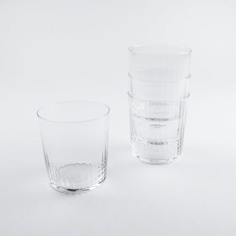 Two clear glass tumblers on a white background