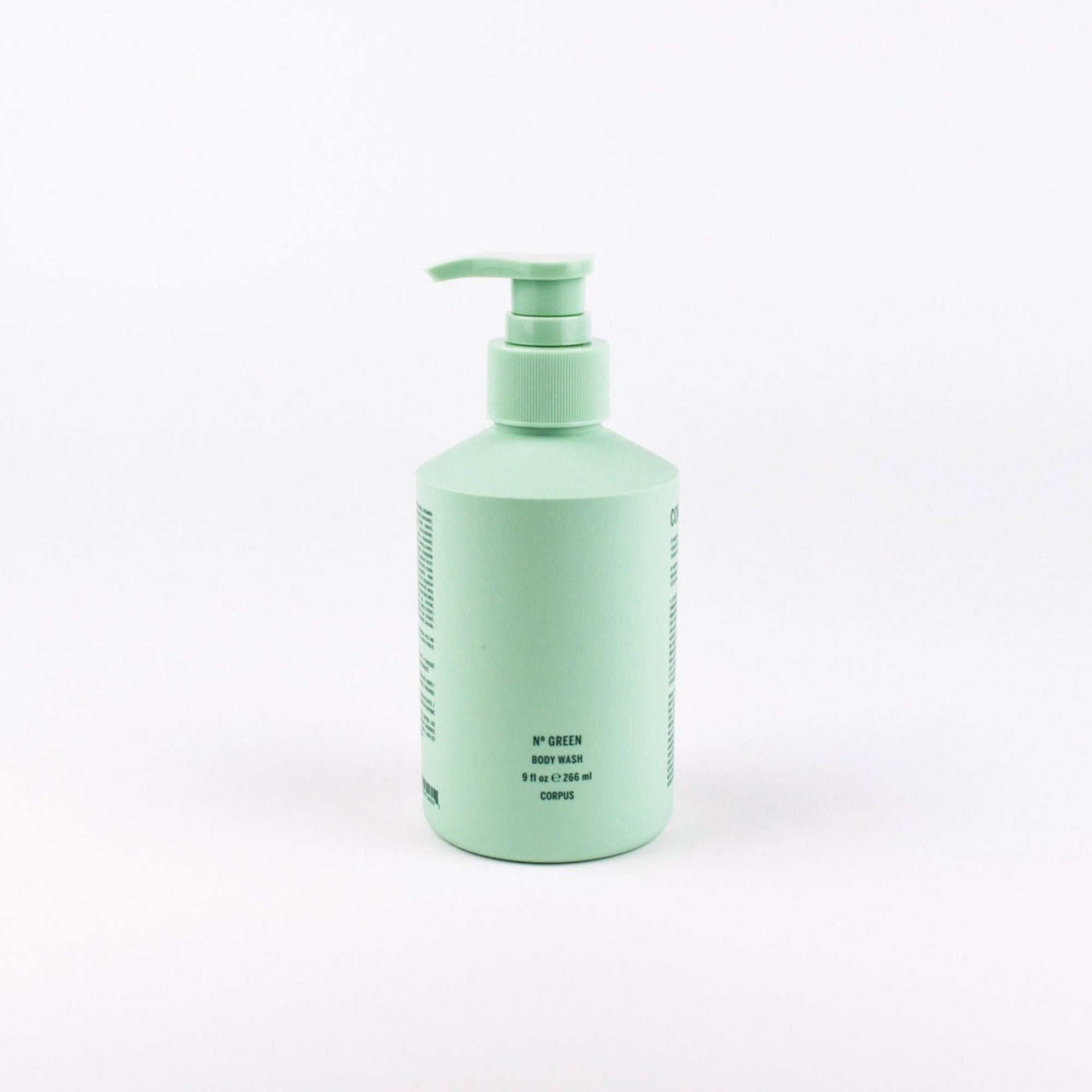 A mint green pump bottle of body wash on a clean white background.