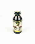 Bottle of hazelnut flavor syrup on a white background