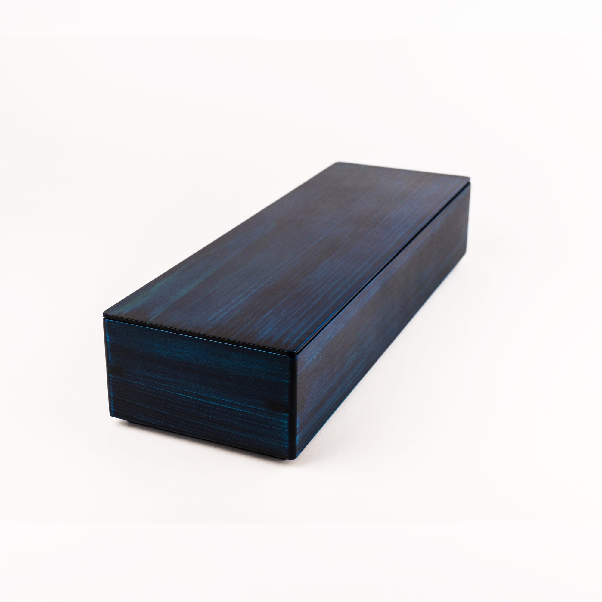 A rectangular dark blue wooden box with a glossy finish and visible wood grain, photographed on a clean white background.