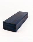 A rectangular dark blue wooden box with a glossy finish and visible wood grain, photographed on a clean white background.