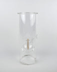 A clear glass cylinder with a spherical bubble chamber insert and a small side port, photographed against a plain light gray studio background.
