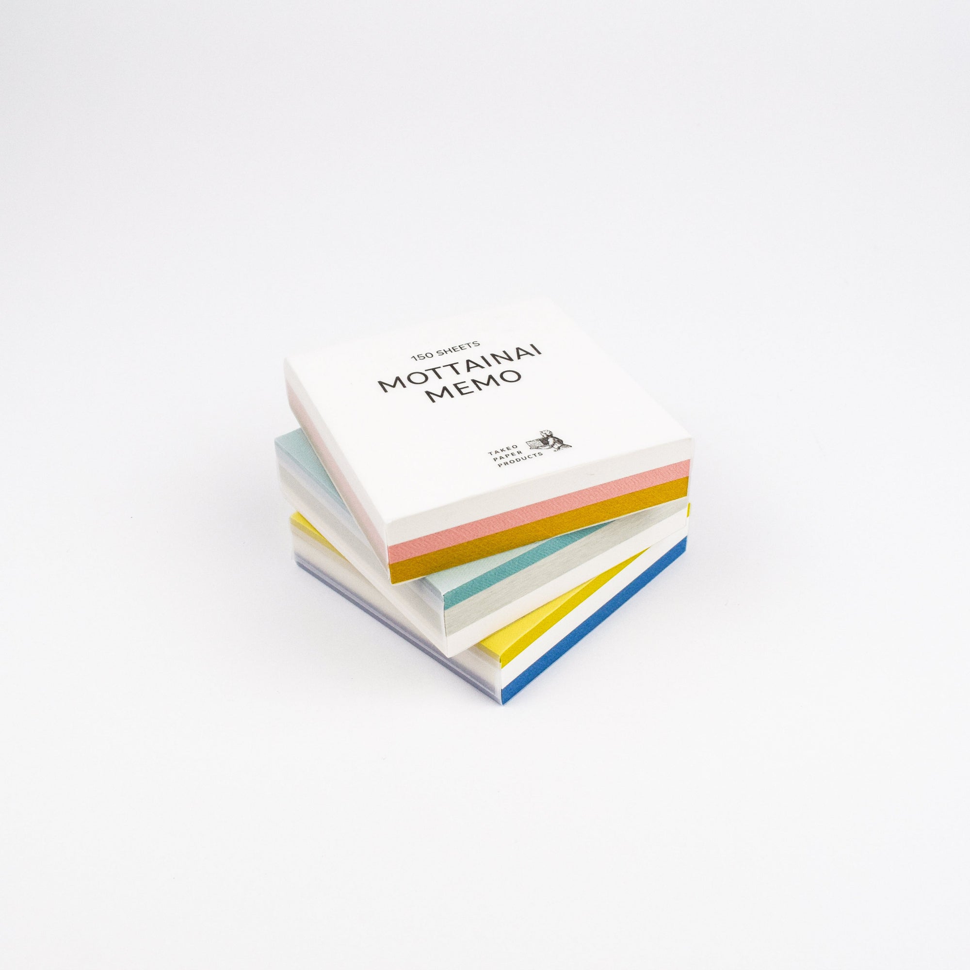 Stack of colorful memo pads with 'MOTTAINAI MEMO' text on a white background