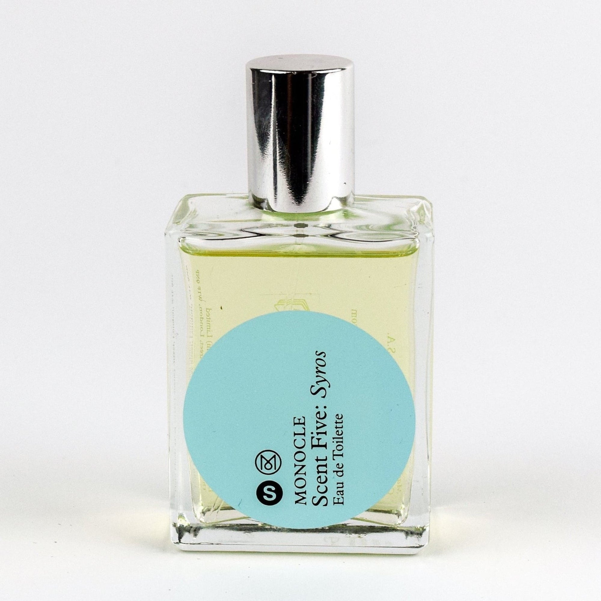 Perfume bottle with a silver cap and a blue label on a white background