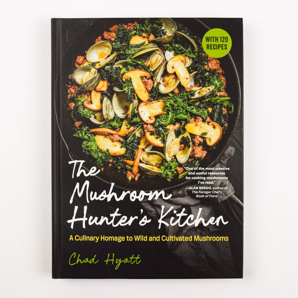 Cookbook titled 'The Mushroom Hunter's Kitchen' with a black cover featuring mushrooms and greens.