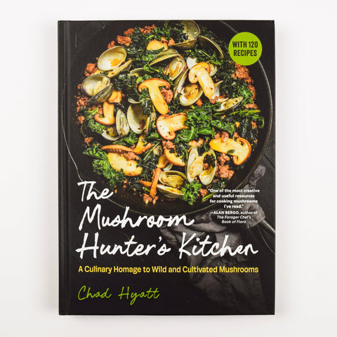 Cookbook titled 'The Mushroom Hunter's Kitchen' with a black cover featuring mushrooms and greens.