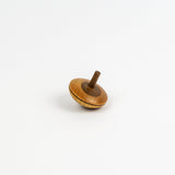 Wooden spinning top on a white background