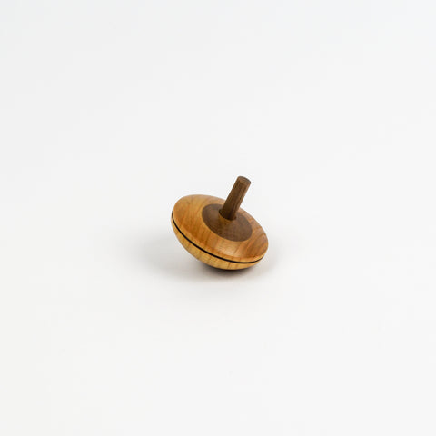 Wooden spinning top on a white background