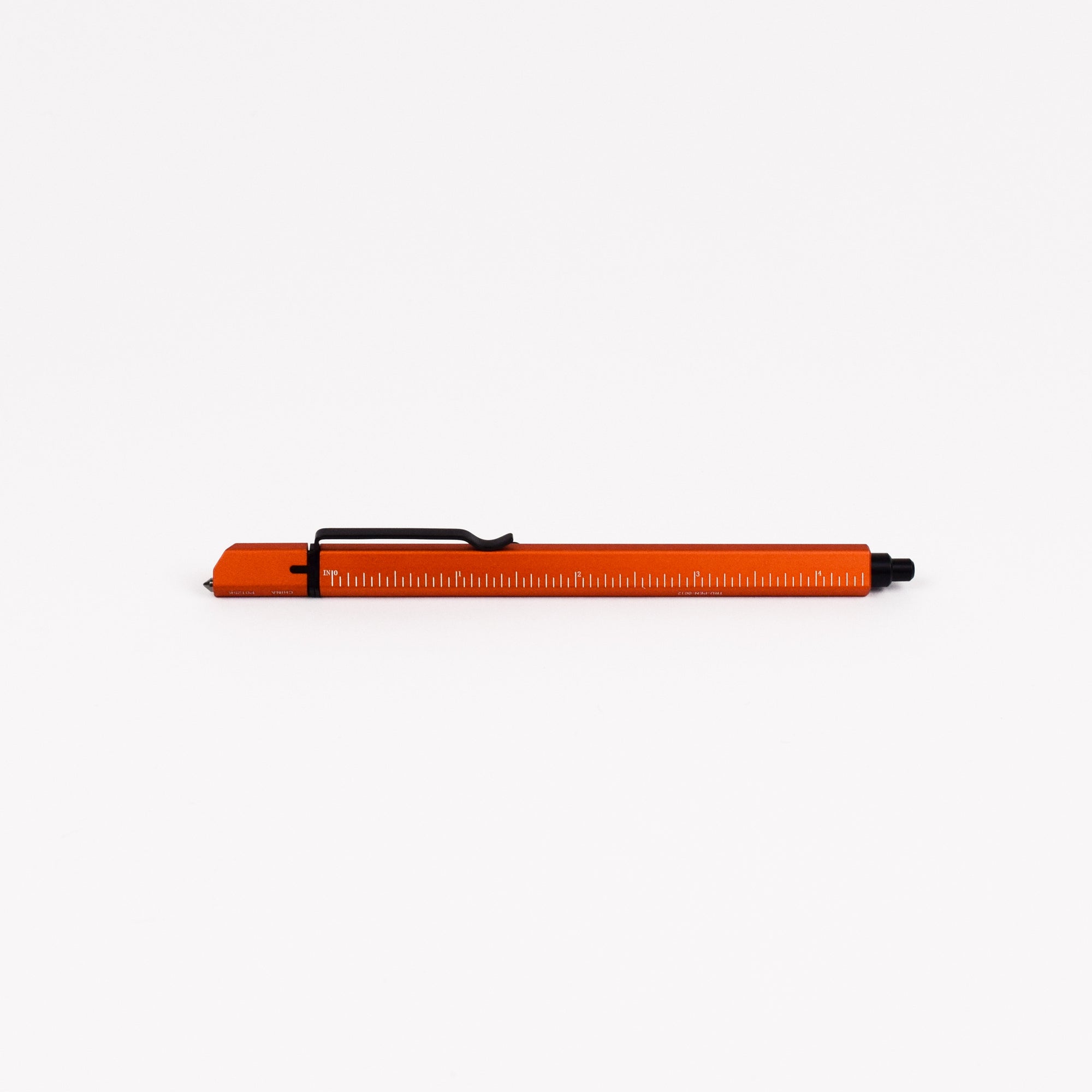 Orange pen with black clip on a white background