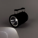 Black flashlight on a gray background