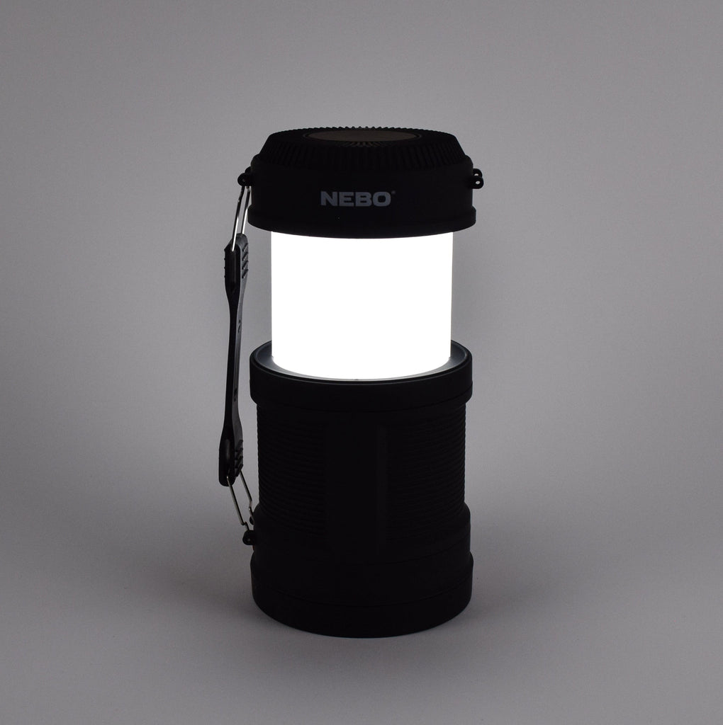 Black camping lantern with NEBO branding on a gray background