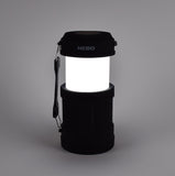 Black camping lantern with NEBO branding on a gray background