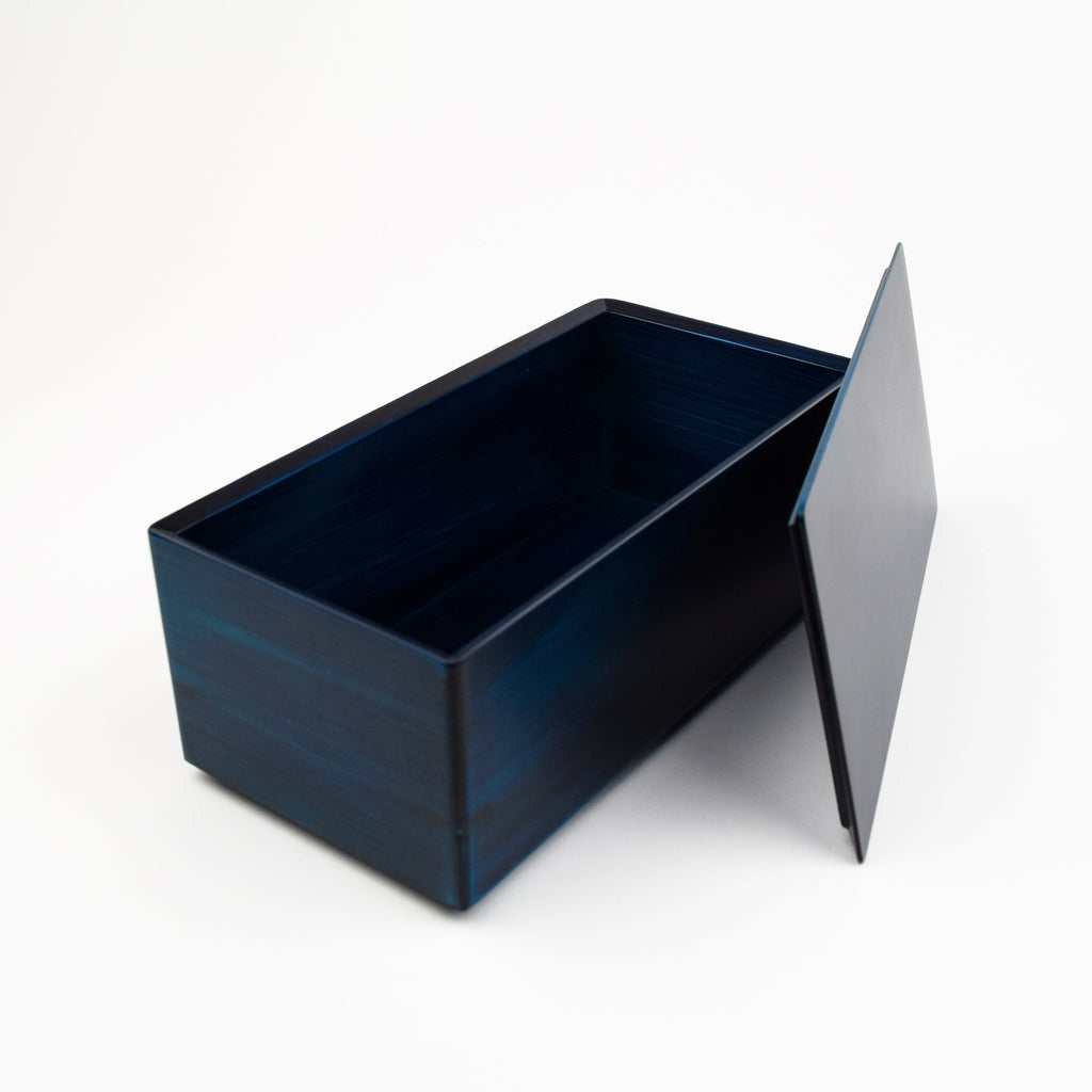 Blue rectangular box with a lid on a white background