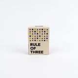 Small box with geometric pattern and 'Rule of Three' text on a white background