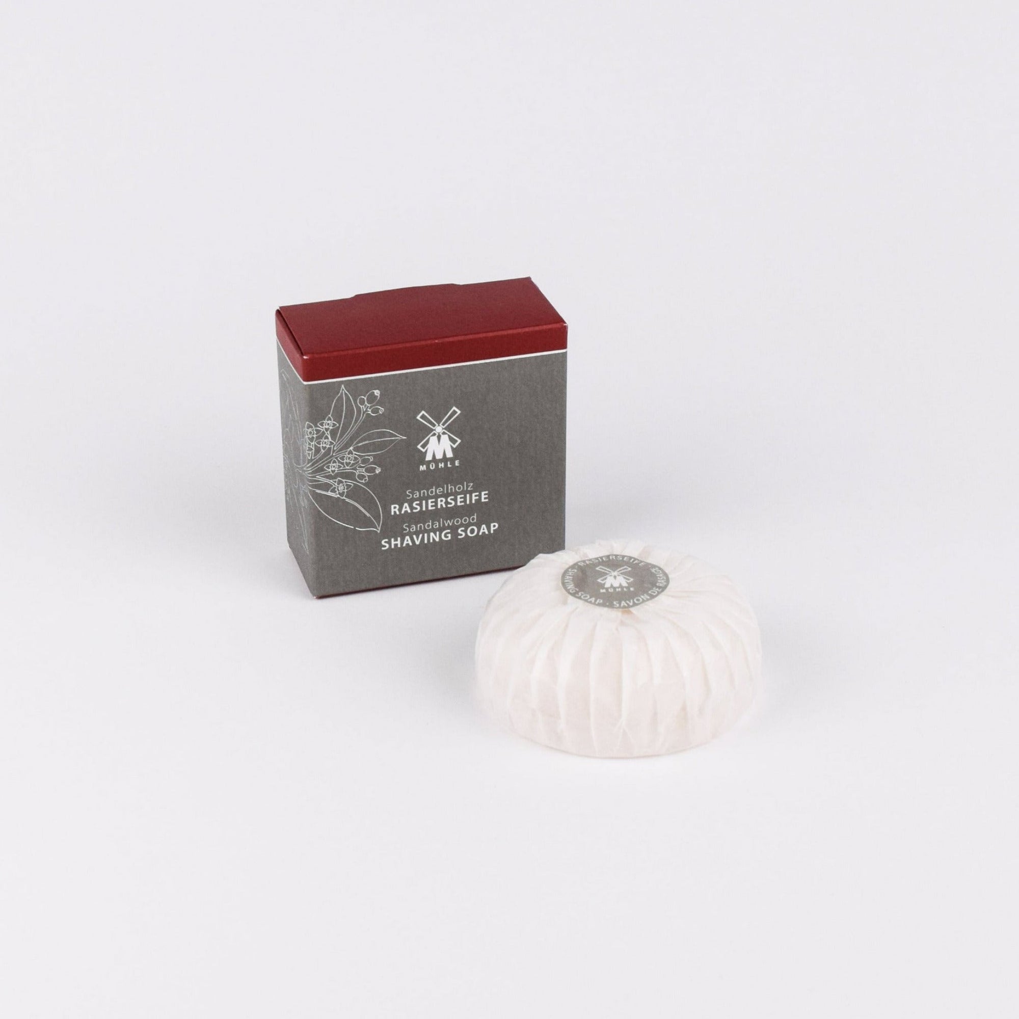 Shaving soap bar with packaging on a white background