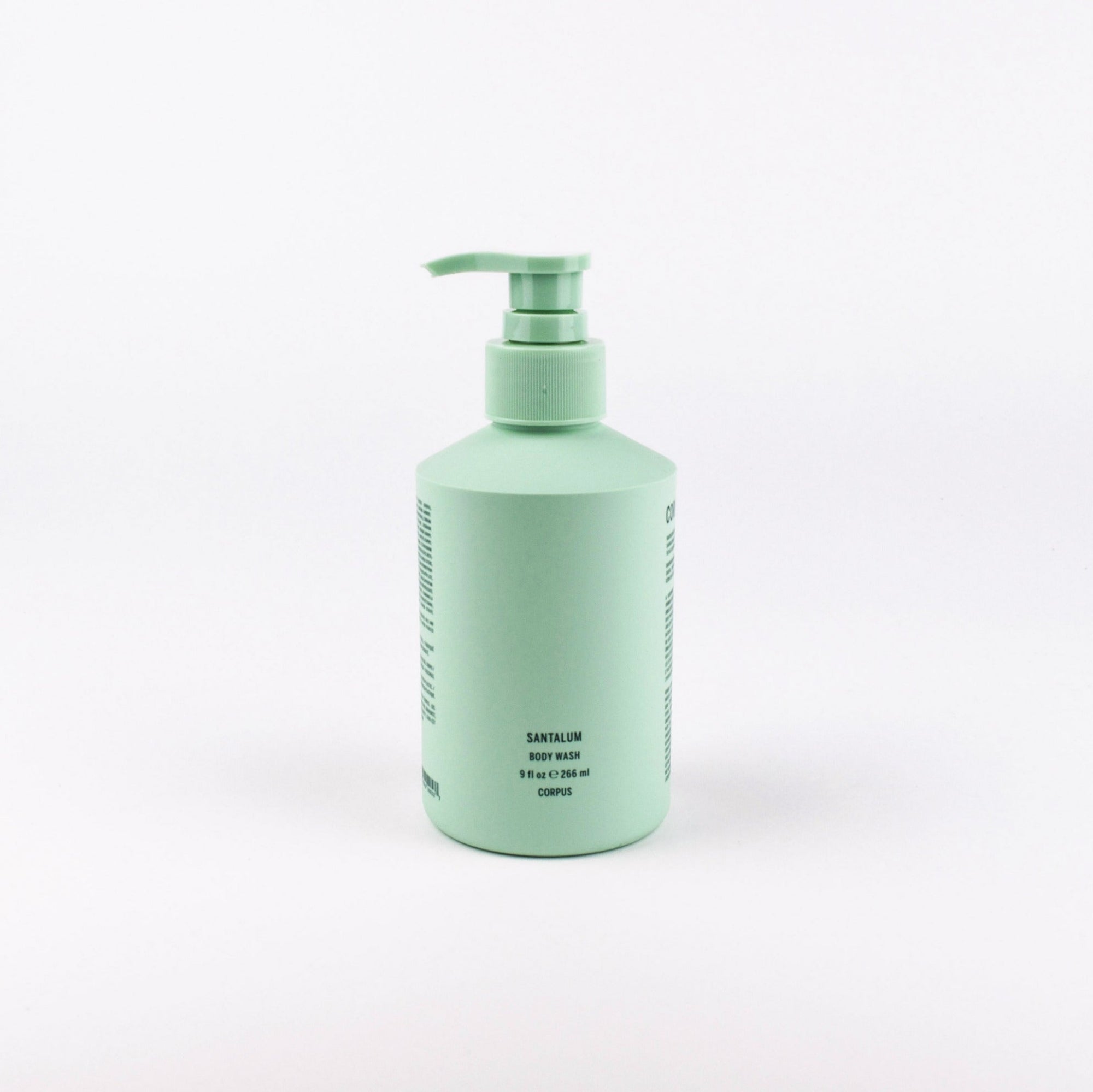 A mint green pump bottle of Santalum Body Wash on a clean white background.