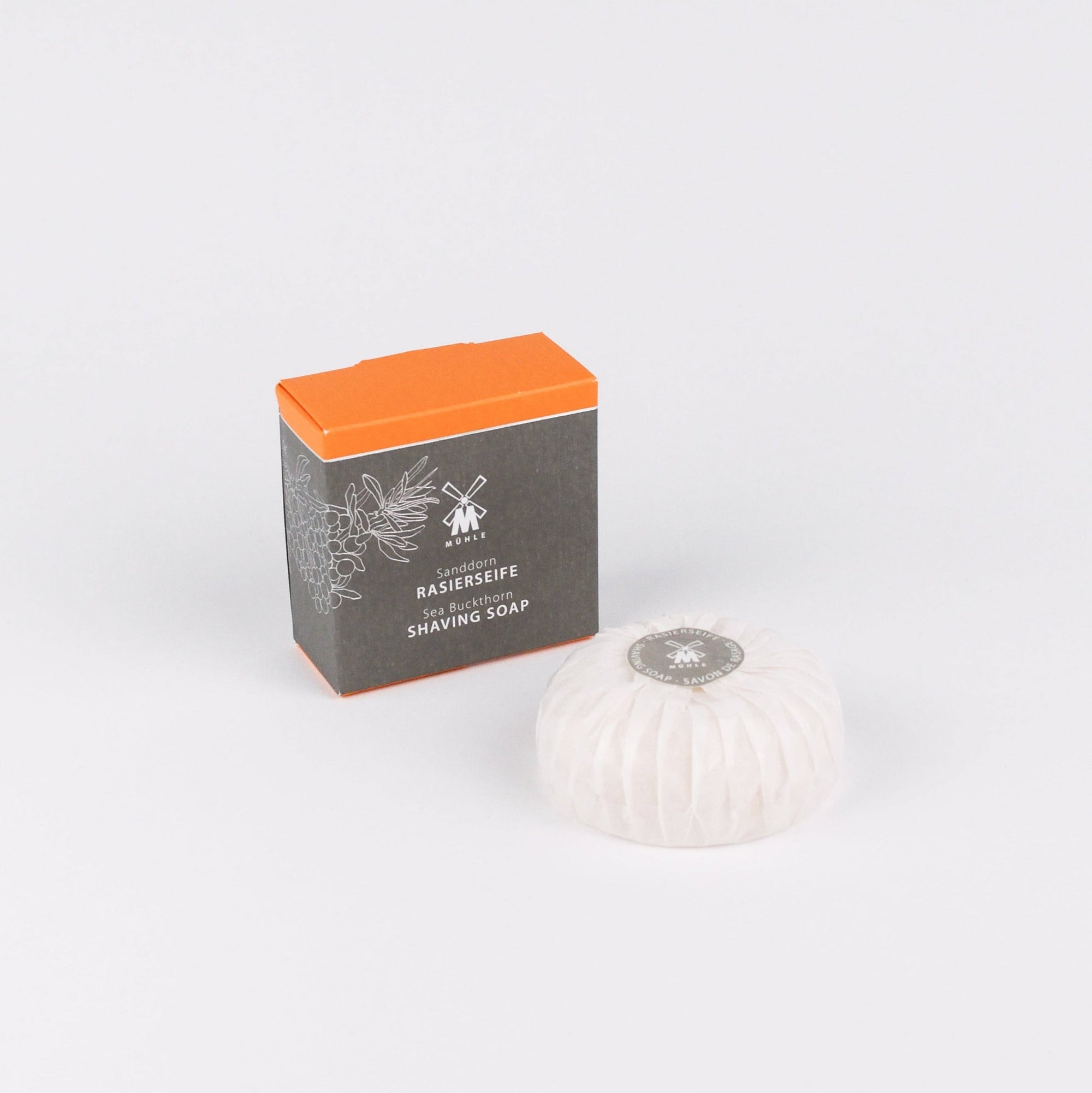 Shaving soap bar with packaging on a white background