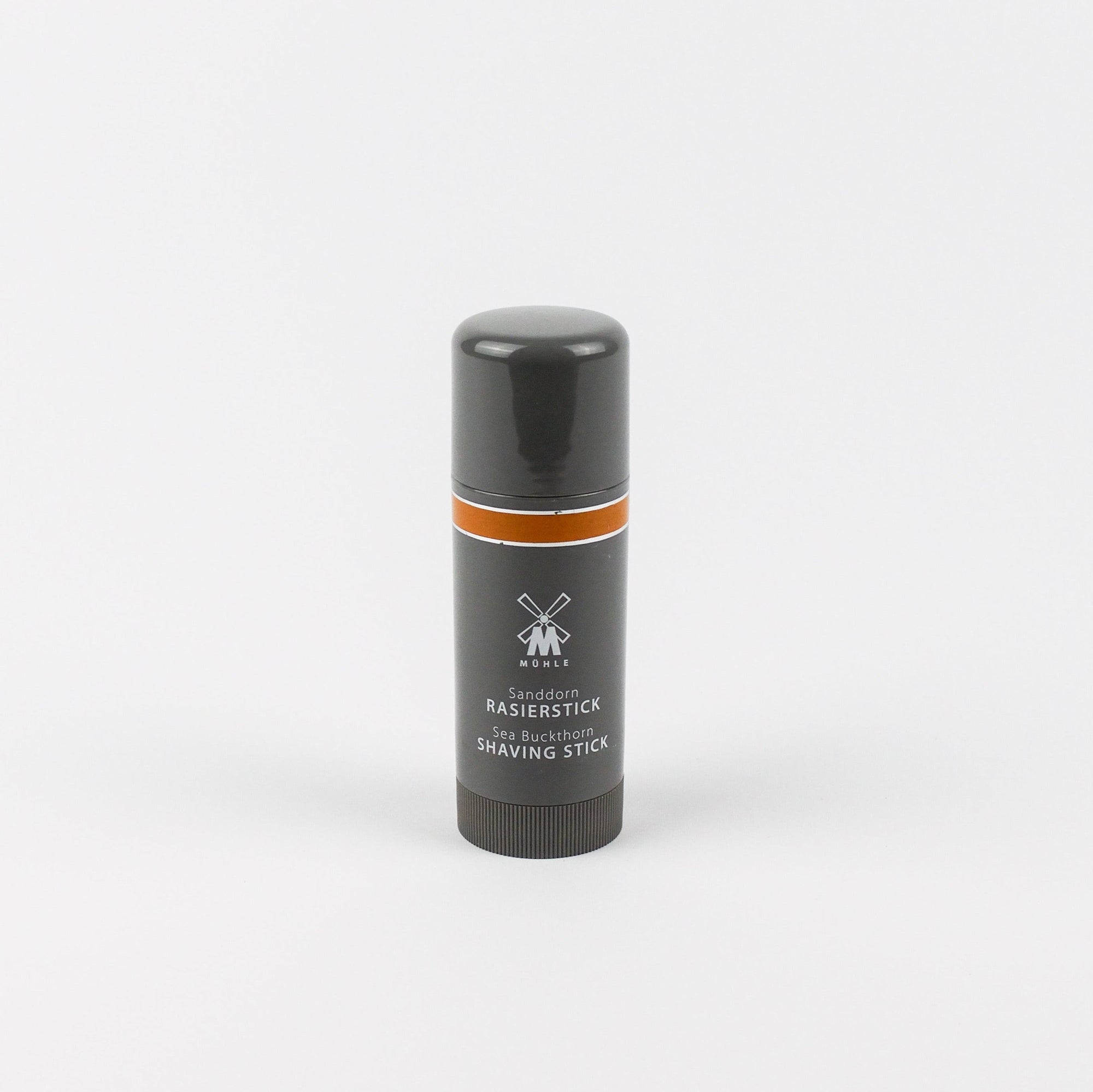 Shaving stick with black and orange design on a white background