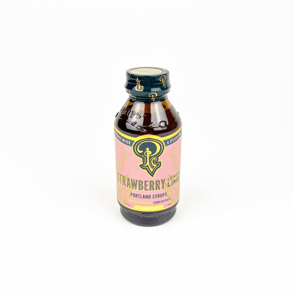 Bottle of strawberry lemonade syrup on a white background