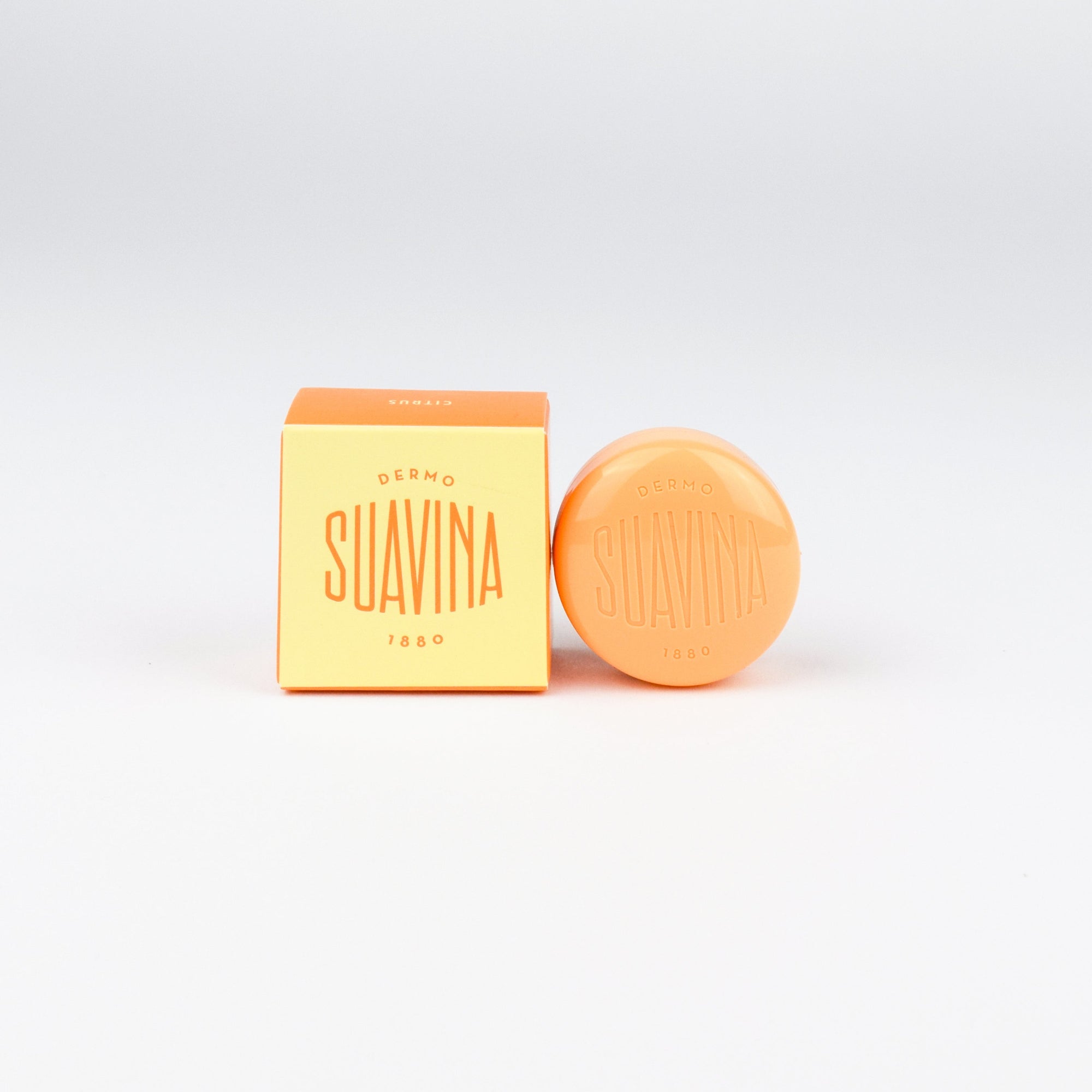 Suavina citrus lip balm and packaging on a white background
