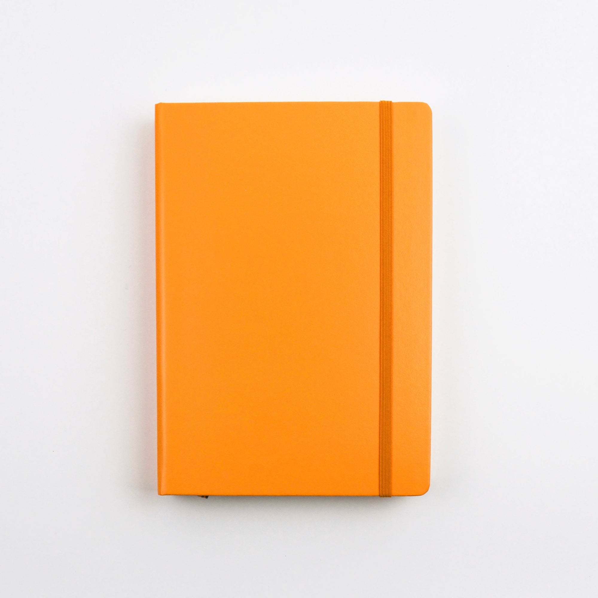 Orange notebook on a light gray background