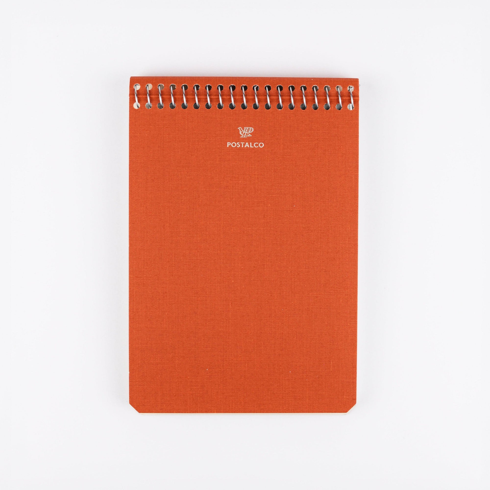 Orange spiral-bound notebook with 'POSTALCO' branding on a white background