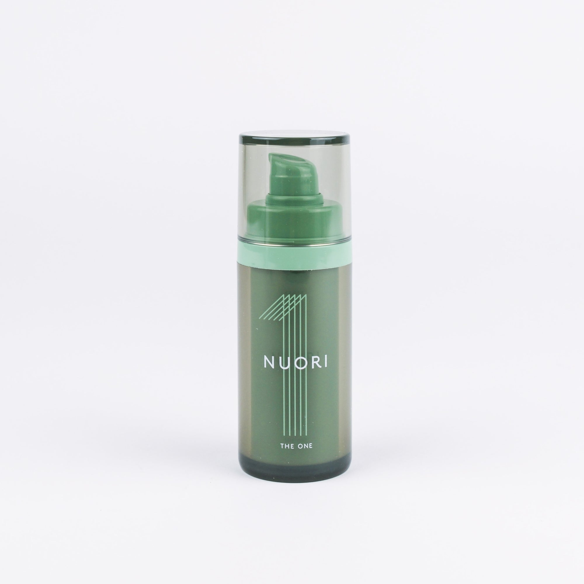 A Nuori skincare pump bottle in a muted sage green color, featuring a clear cap and a mint green collar band, set against a plain white background.