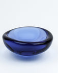 Blue glass bowl on a white background
