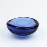 Blue glass bowl on a white background