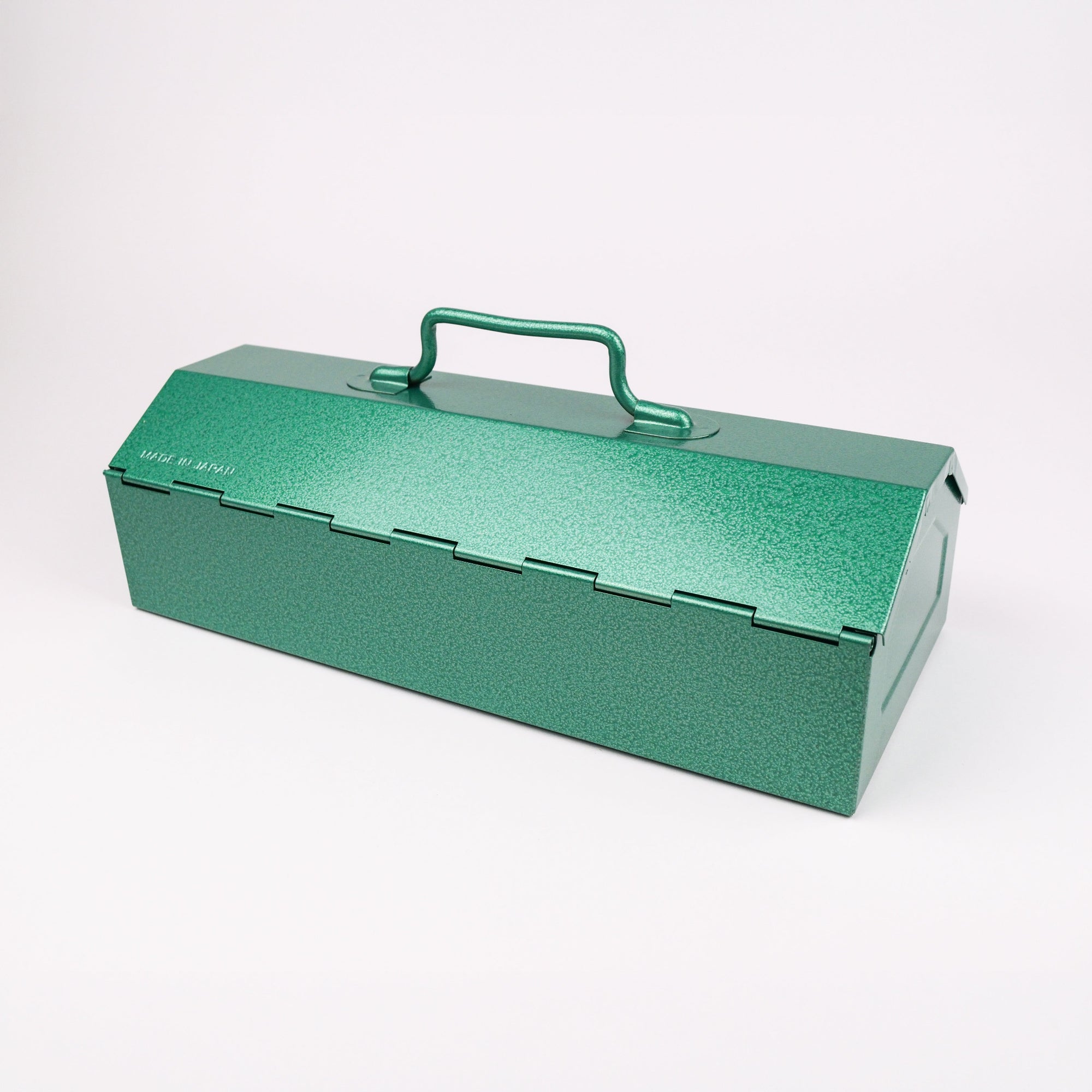 Green metal toolbox with a handle on a white background