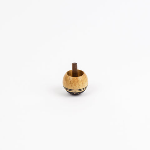 Wooden spinning top on a white background