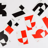 Playing cards with abstract designs on a white background