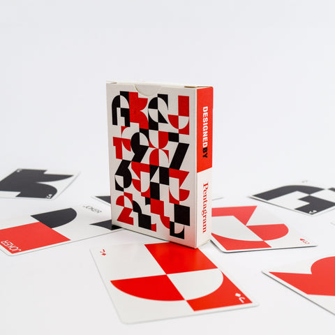 Playing cards with geometric design and a visible brand on a white background