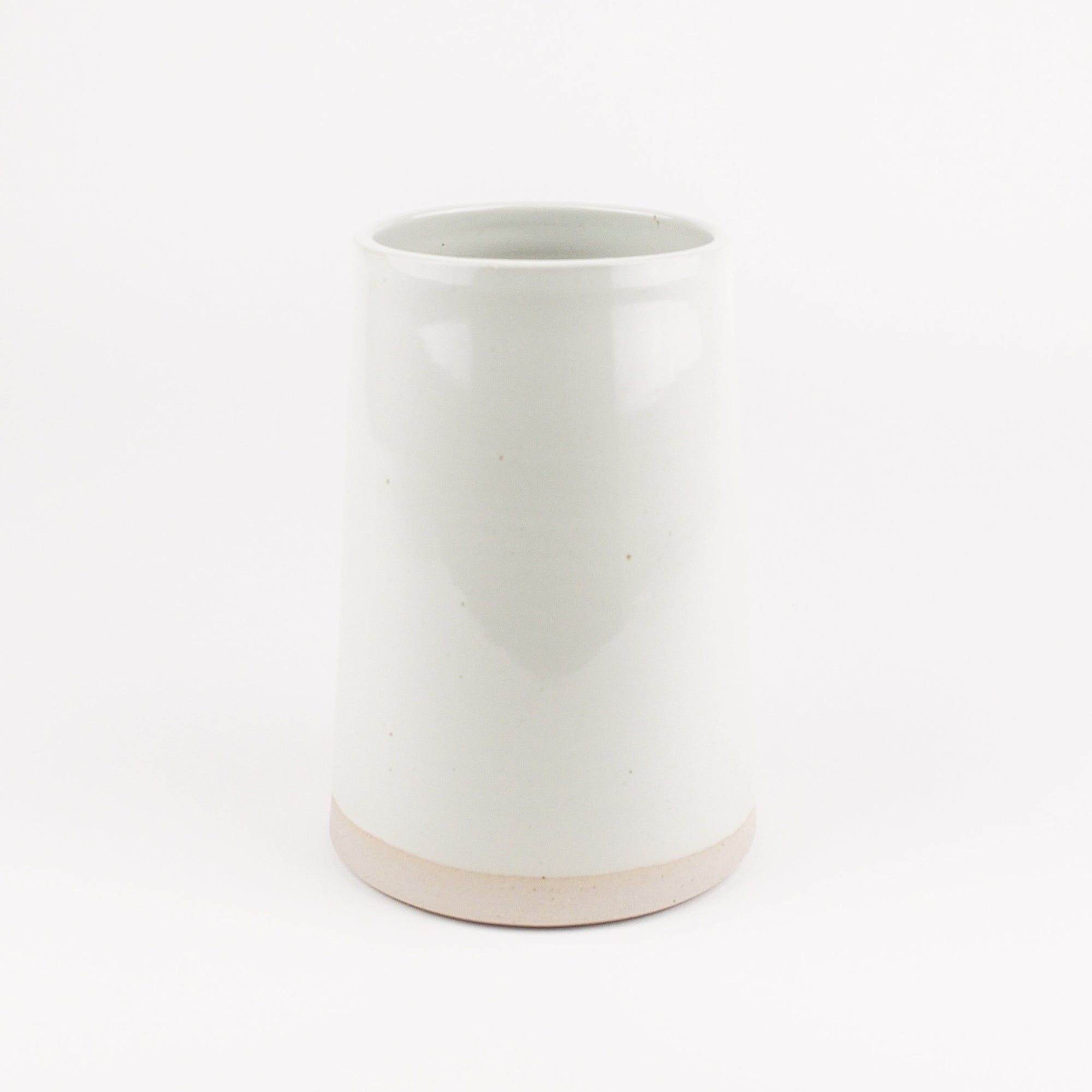 White ceramic vase on a white background