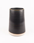Charcoal glazed ceramic vase on a white background