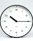 aira clock white dial black metal case