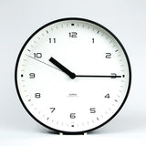 aira clock white dial black metal case