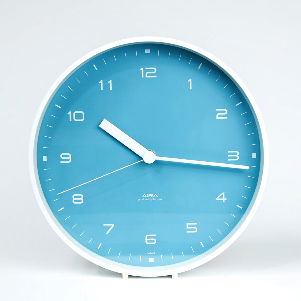 aira clock blue dial white metal case