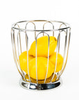 alessi citrus basket in polished steel with lemons