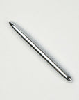 A silver Fisher Space Pen on a white background.