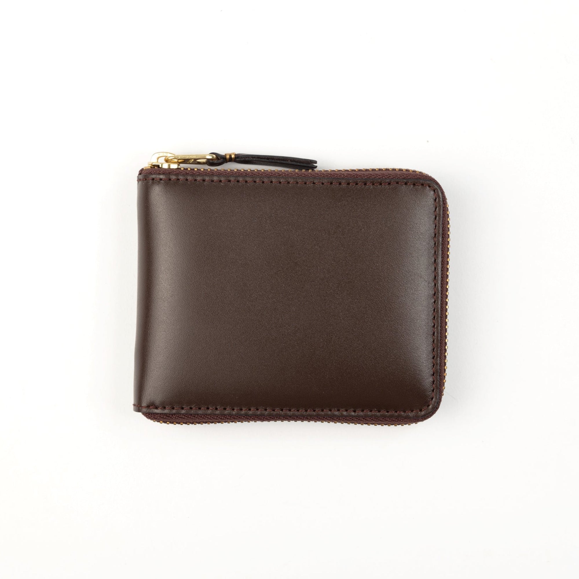 A brown leather wallet with a zipper closure and gold-toned metal hardware.