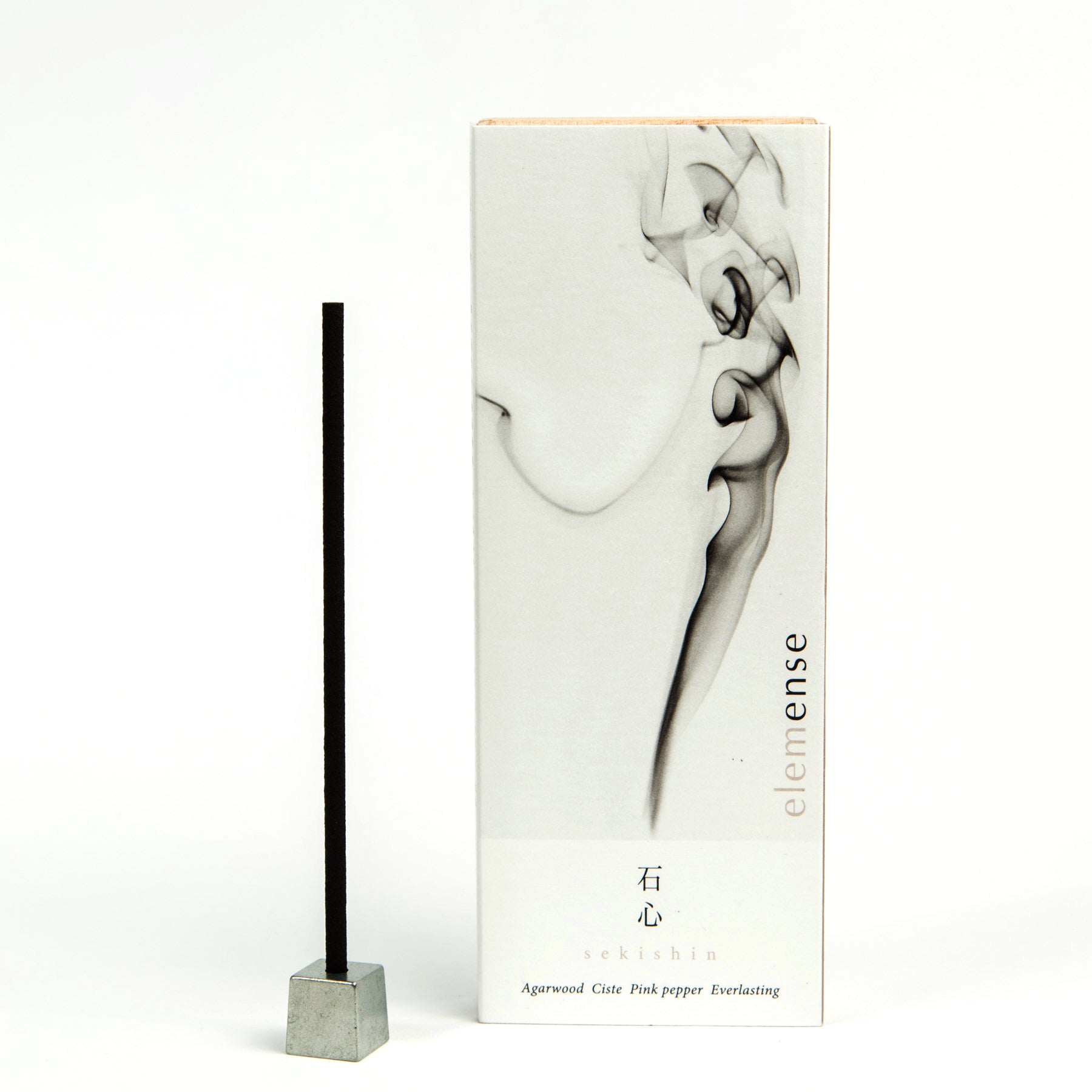 A box of Elemense incense with a single incense stick placed in front, against a white background with a minimalist design.
